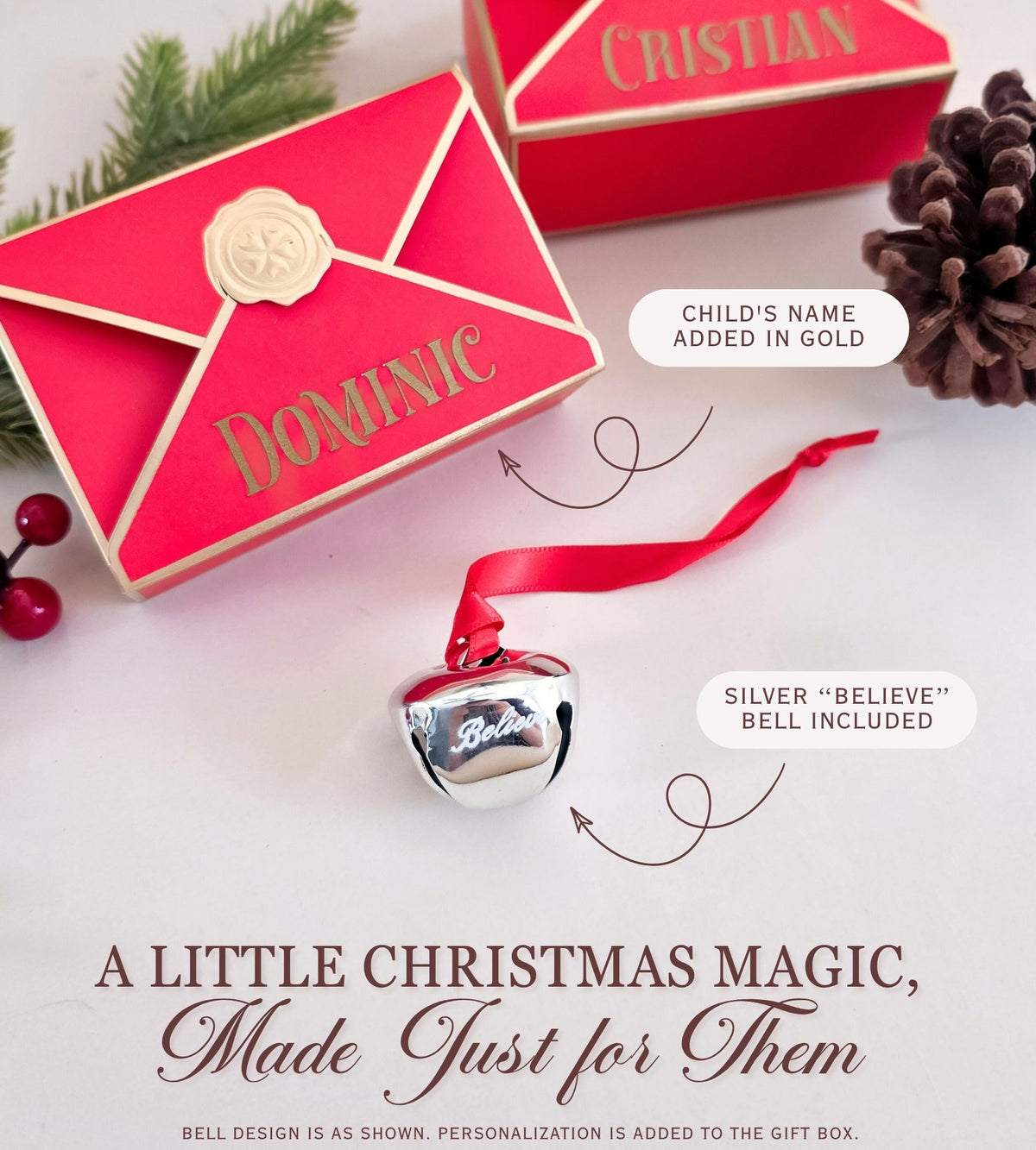 Personalized red Christmas gift boxes with gold trim and wax seal details, shown alongside a small silver bell with a red ribbon. Text labels indicate the name Dominic and that a silver bell is included.