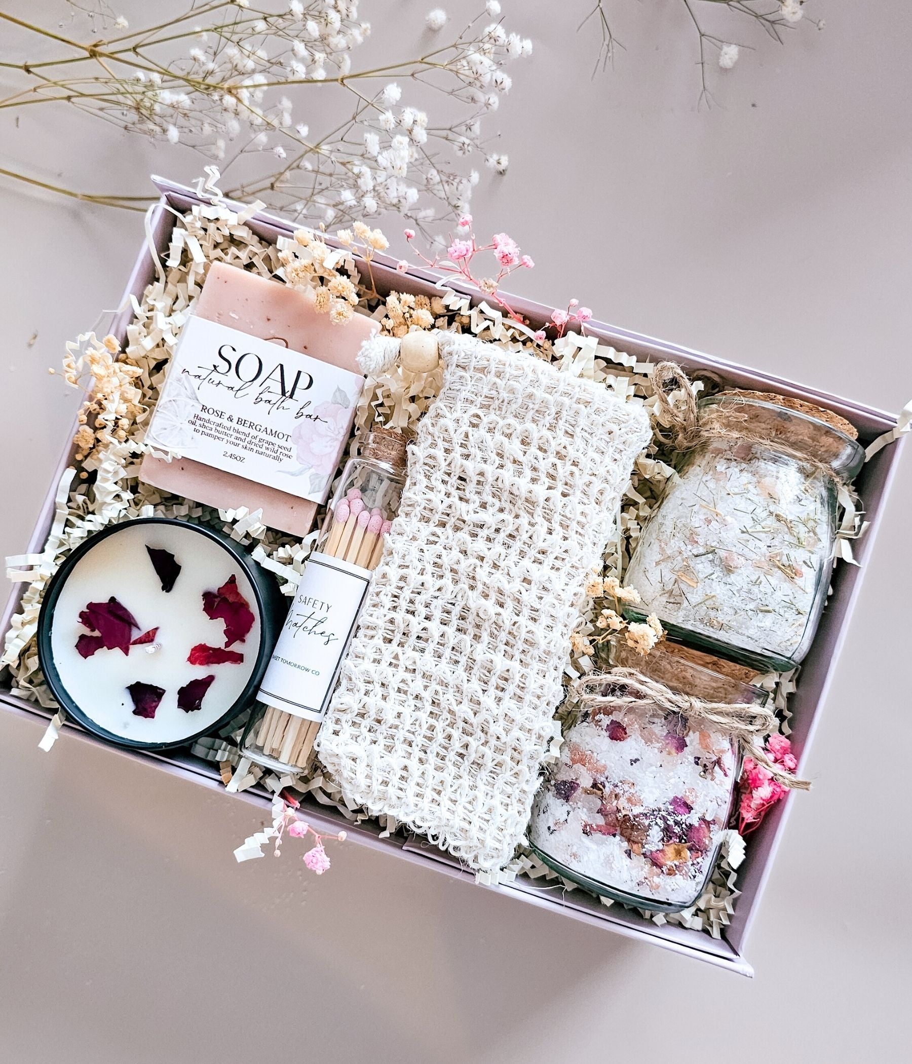 Natural self care spa gift box with bath salts, candle, soap, matches, and exfoliating pouch in a magnetic keepsake box