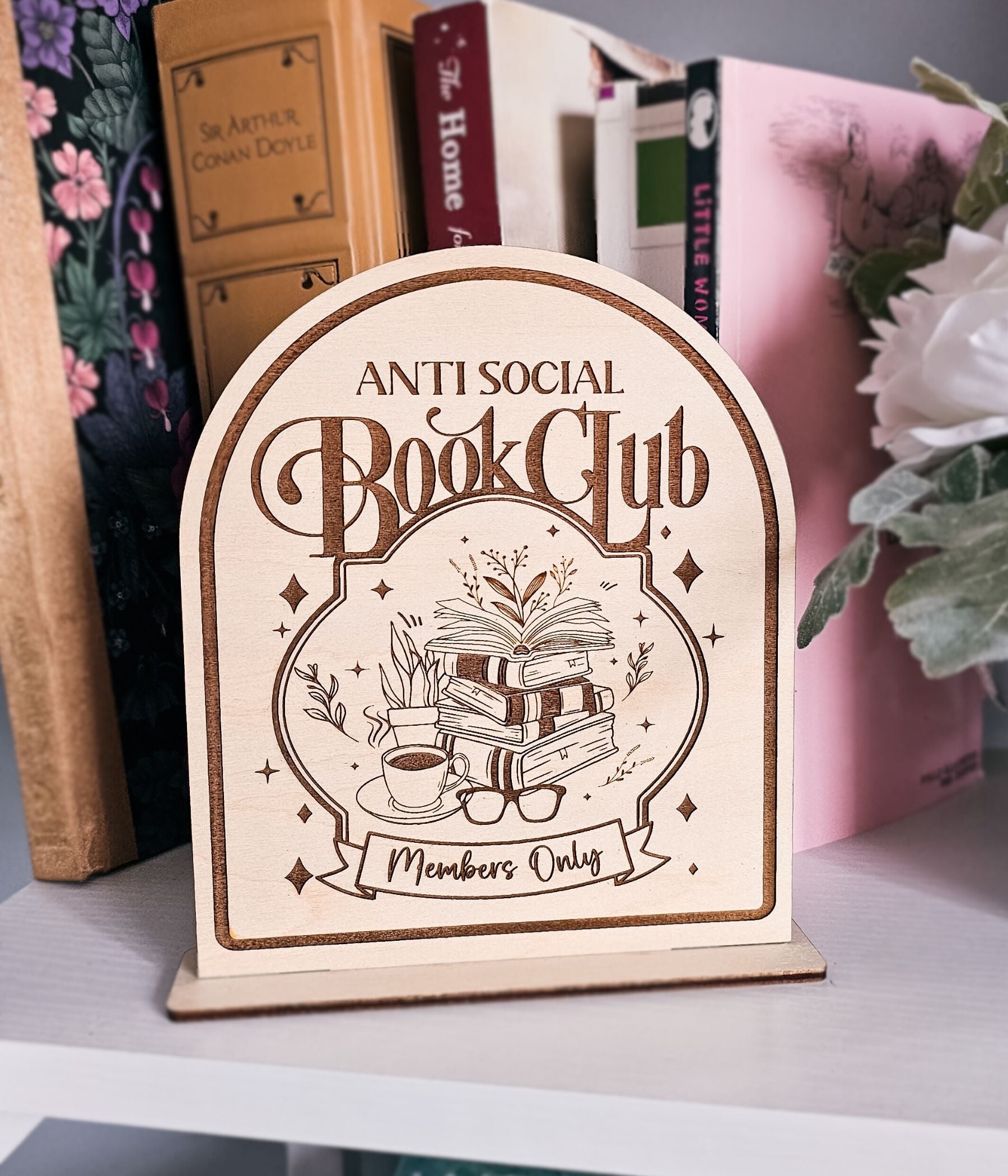 Antisocial Book Club wooden shelf sign with laser-engraved book stack illustration and stand