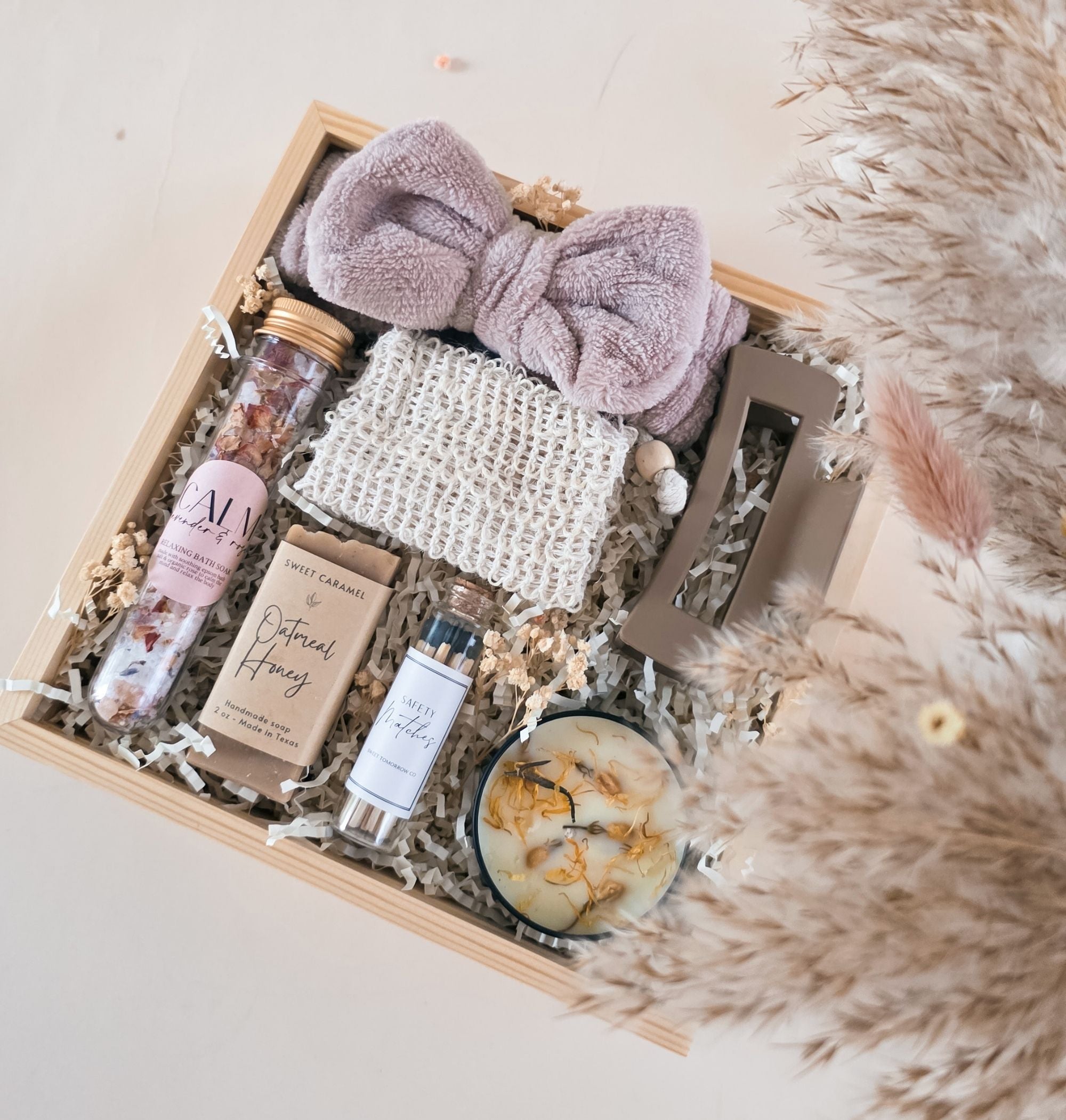 Natural handcrafted soap bar resting in sisal exfoliating sleeve, styled with botanicals