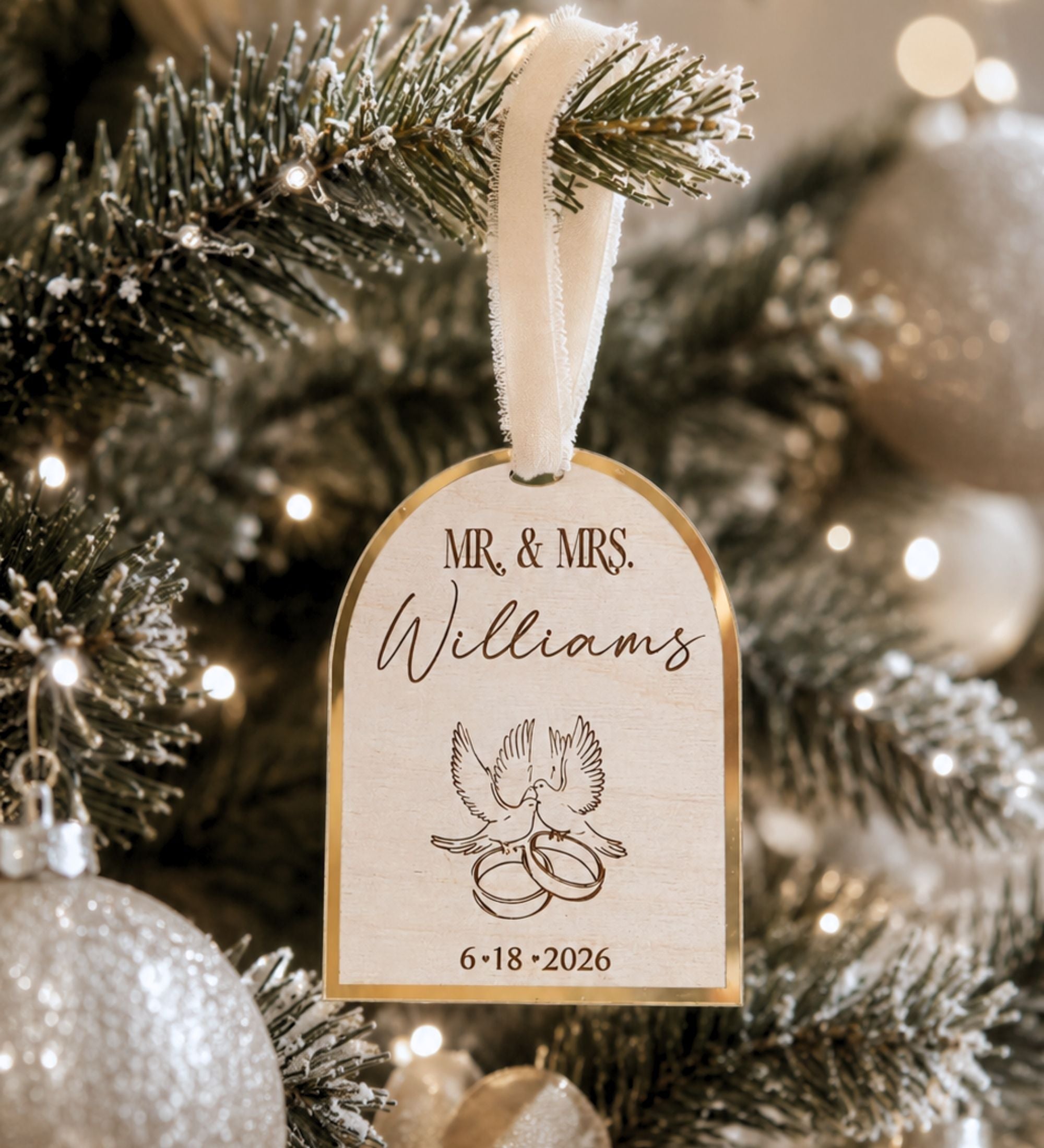 Personalized Christmas ornament in silver mirror finish, showing where the titles, family name, and wedding date are placed on the birch arch