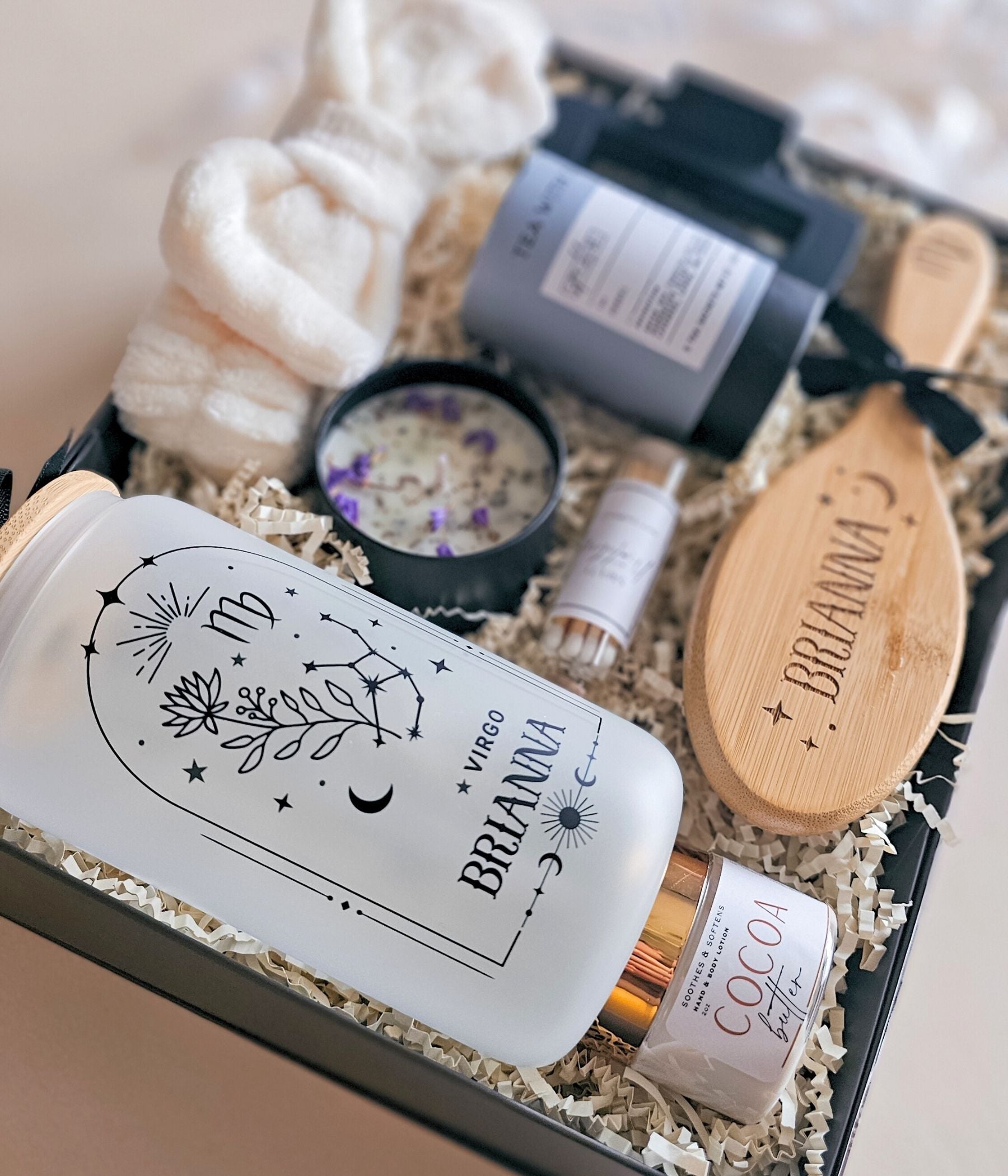 Ultimate zodiac gift box with engraved bamboo hair brush, spa headband, cocoa butter lotion, candle, and personalized tumbler