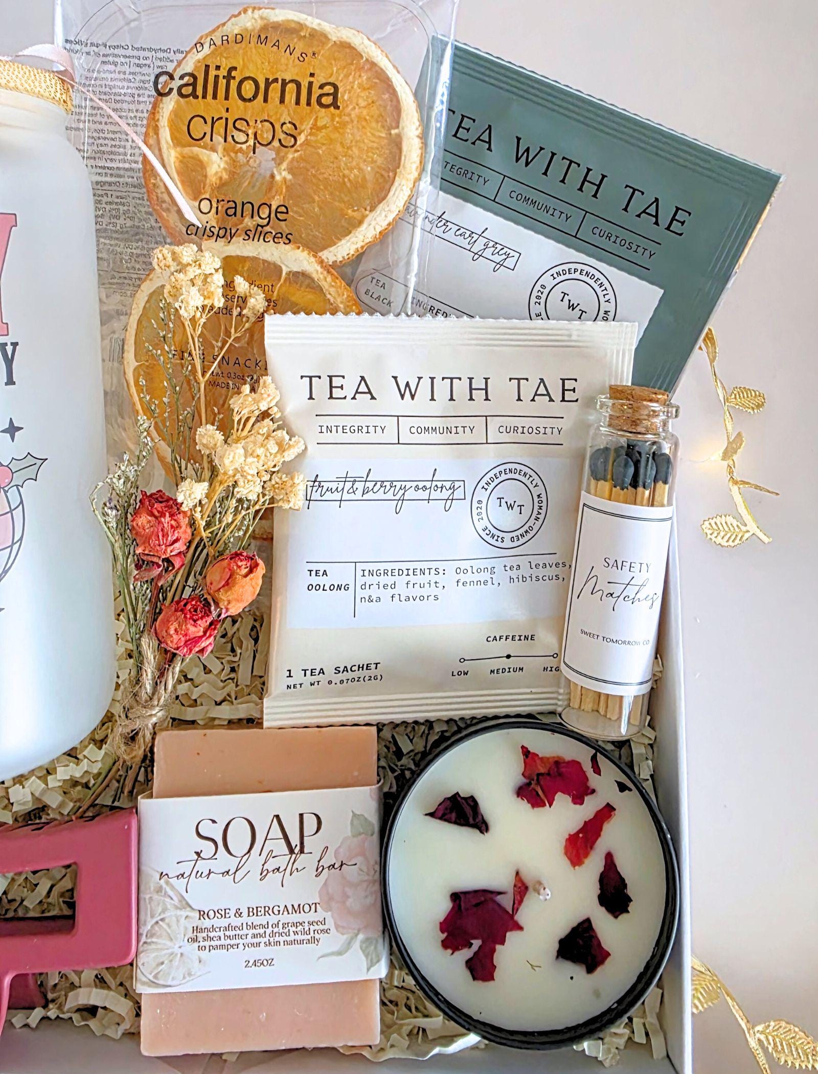 Secret Santa or client appreciation gift—cozy holiday self-care box styled with winter greens