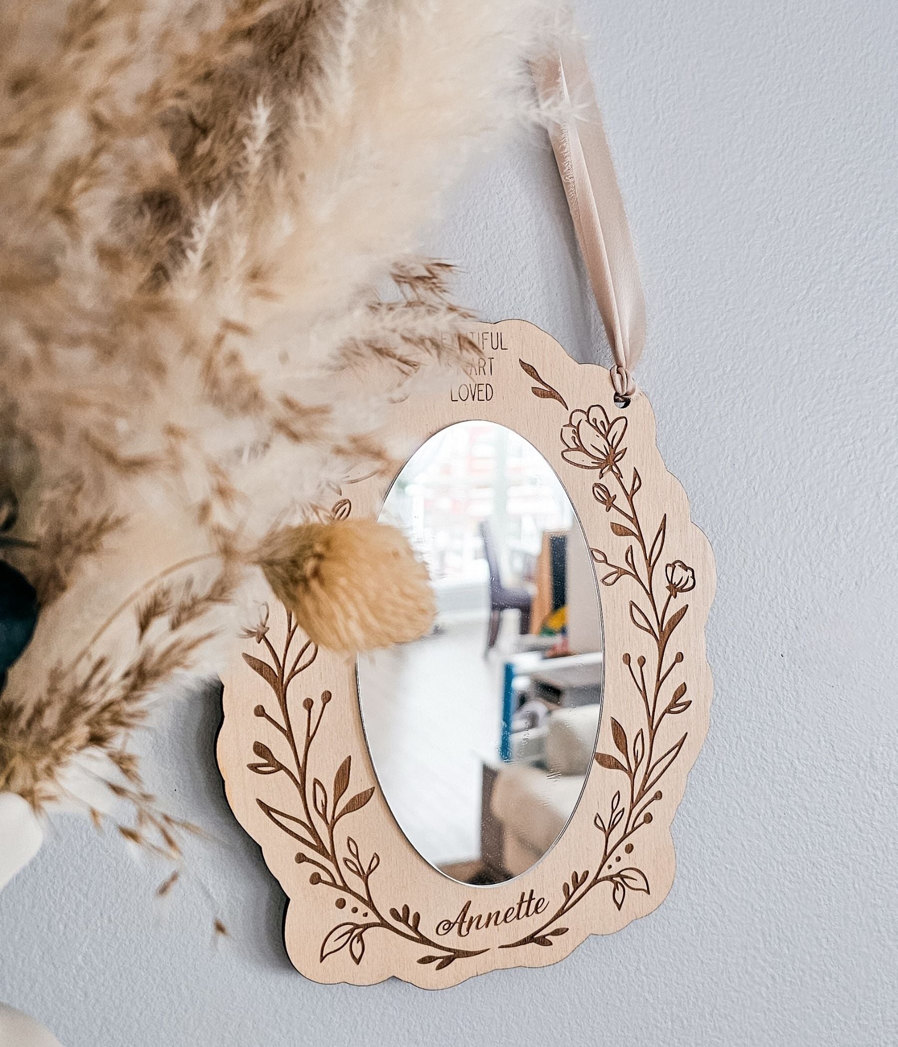 Floral engraved wooden mirror for girls bedroom décor with soft neutral styling