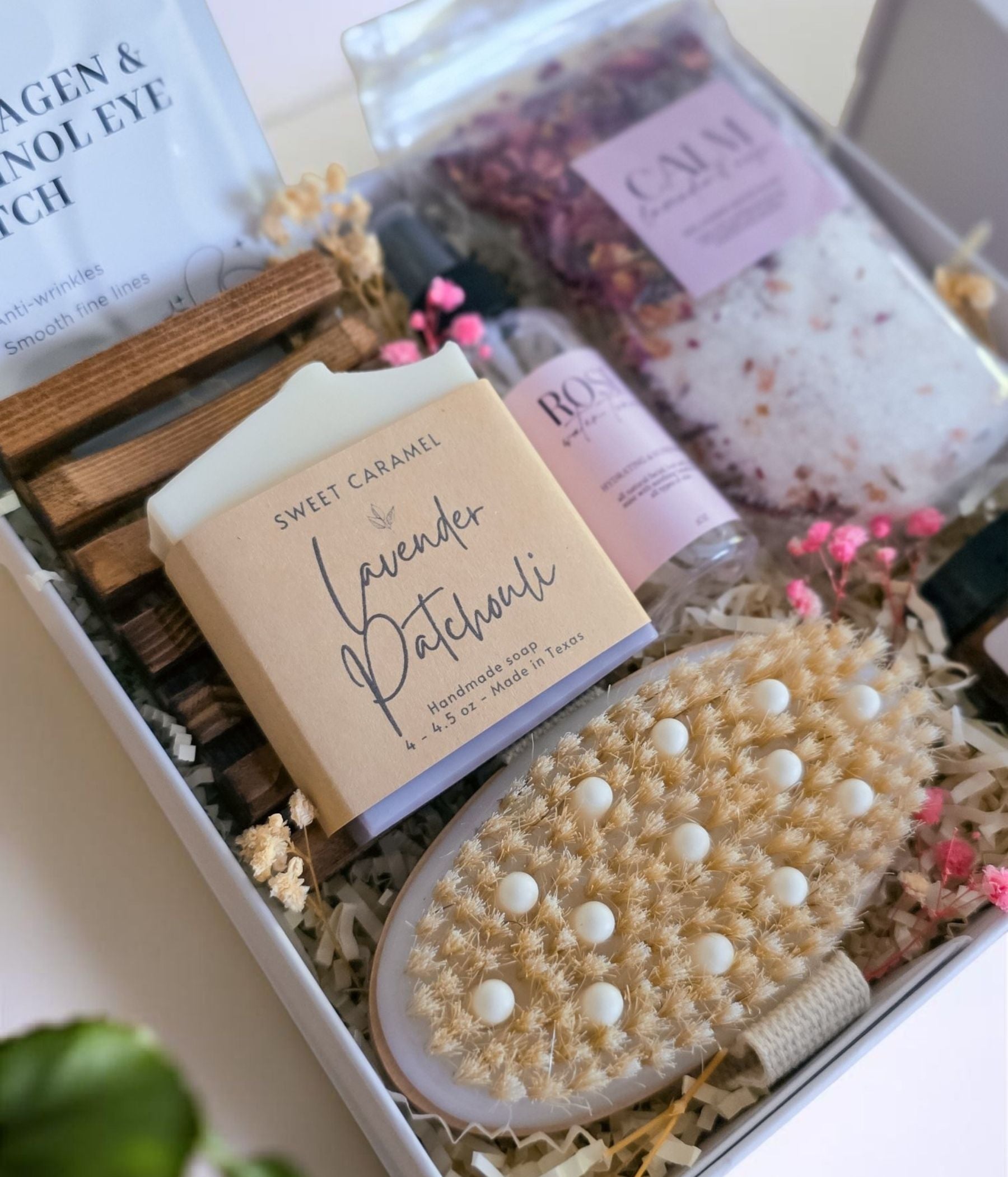 Artisan lavender patchouli soap bar resting on its wooden tray, close enough to show the handmade texture