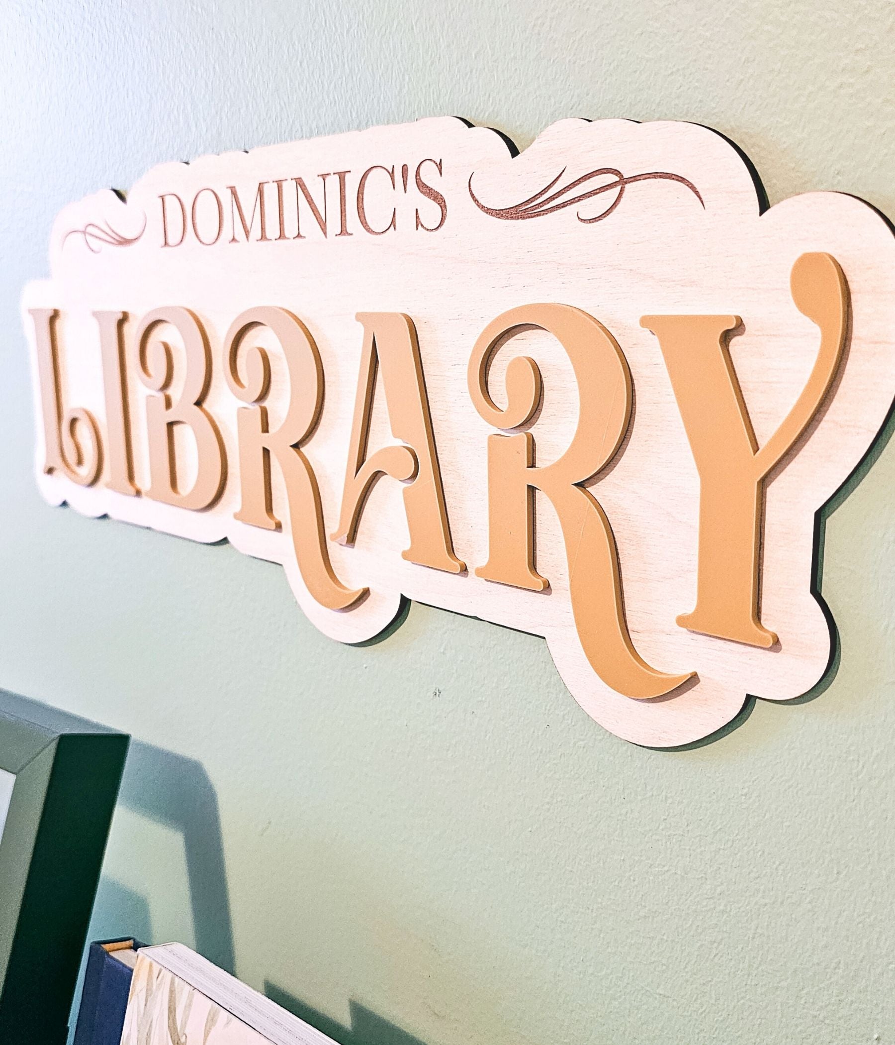 Personalized playroom wall sign made from unstained birchwood with layered letters