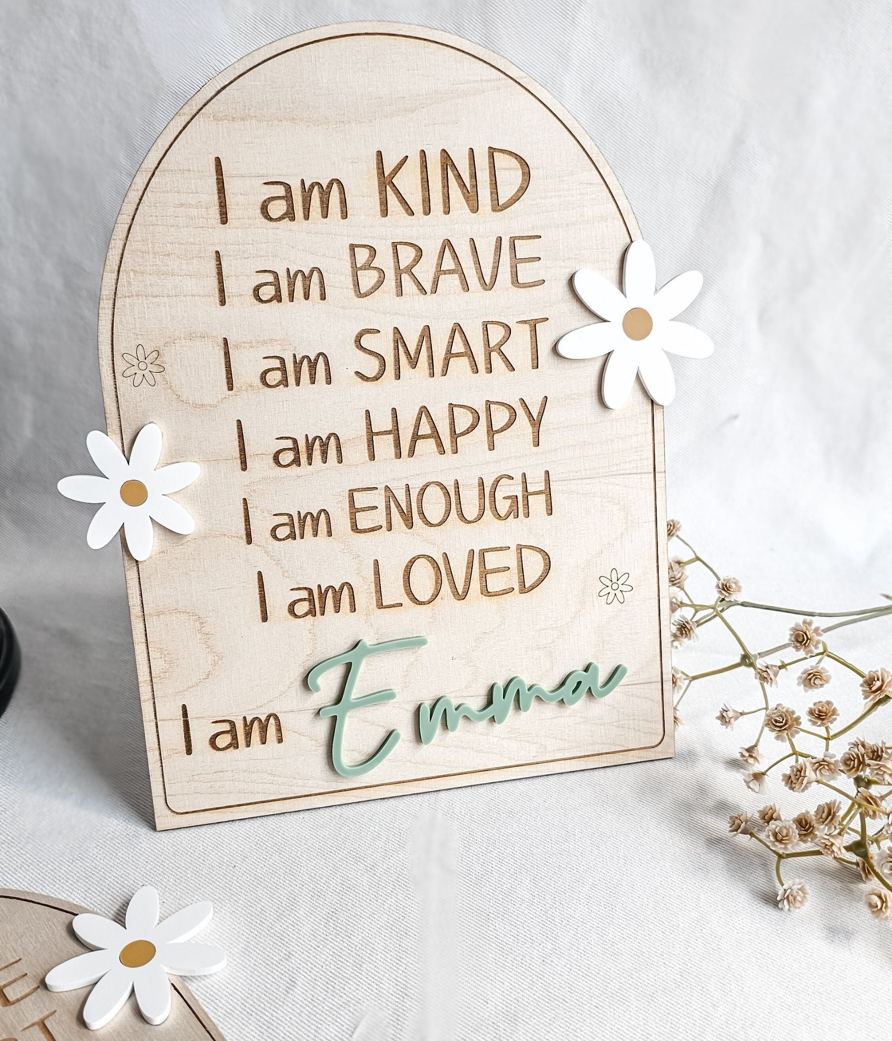 Personalized wooden affirmation sign for kids with engraved “I am” statements and raised blue acrylic name