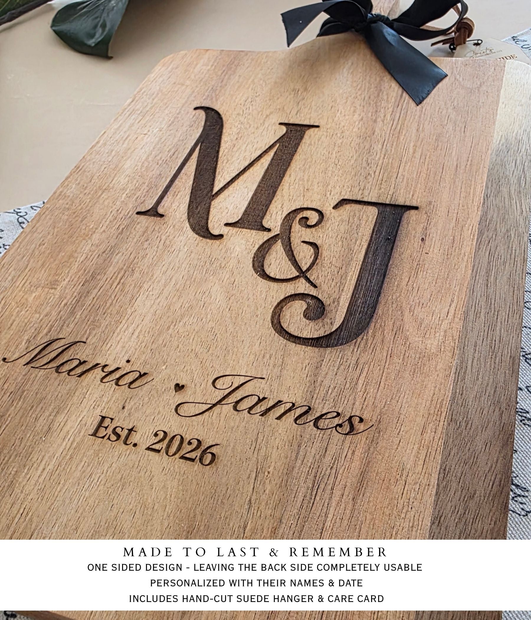 Wedding gift cutting board with initials engraving, towel, and wooden salad servers