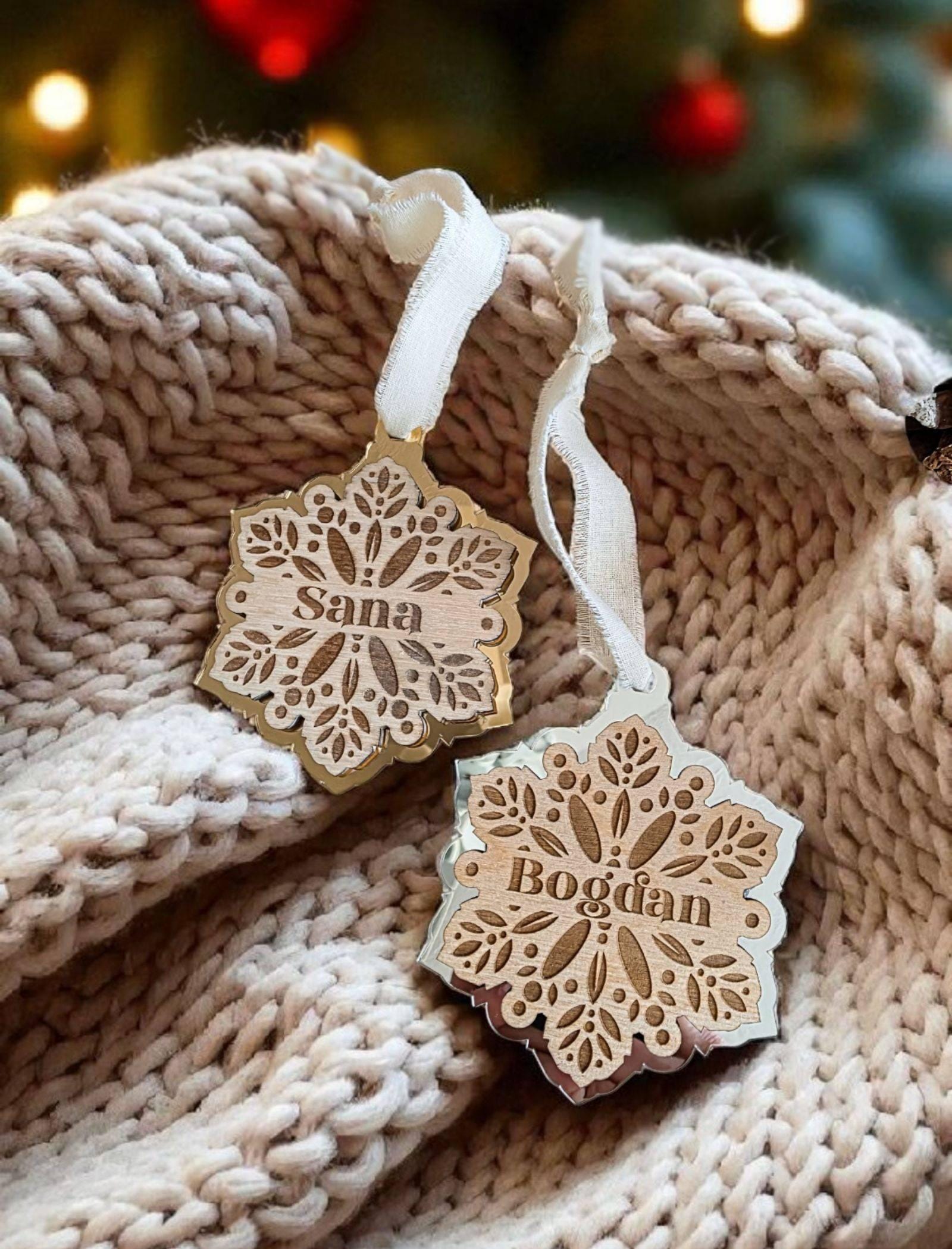 Personalized wooden snowflake ornament with gold mirrored frame and engraved name.