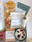 Secret Santa or client appreciation gift—cozy holiday self-care box styled with winter greens