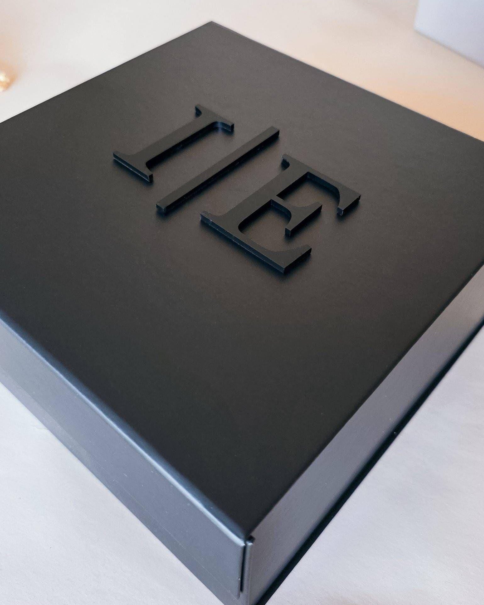 Black magnetic gift box with gold 3D name script on lid