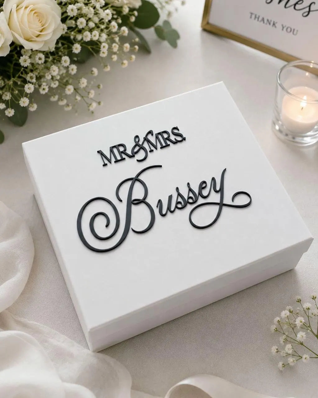 Square white keepsake box with black raised acrylic lettering reading Mr and Mrs above the name Bussey in script